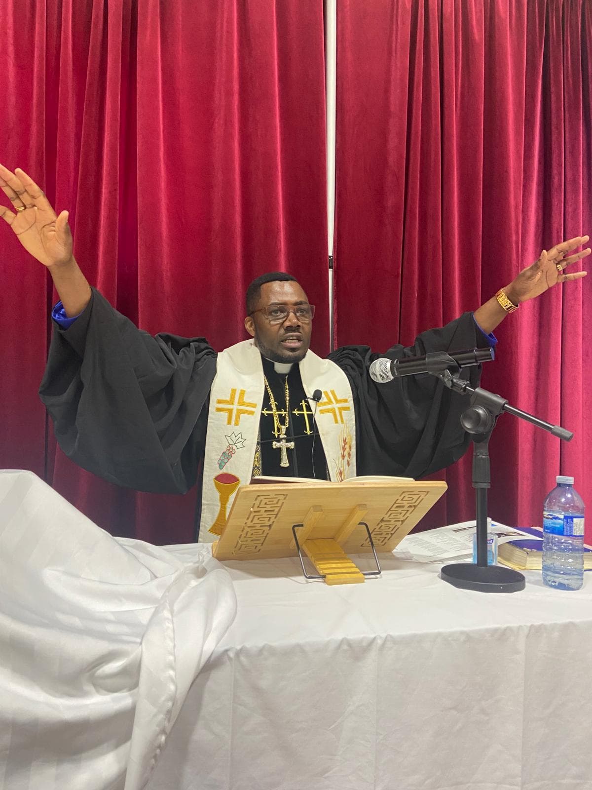 Rev. Oliver Ndula preaching the Word